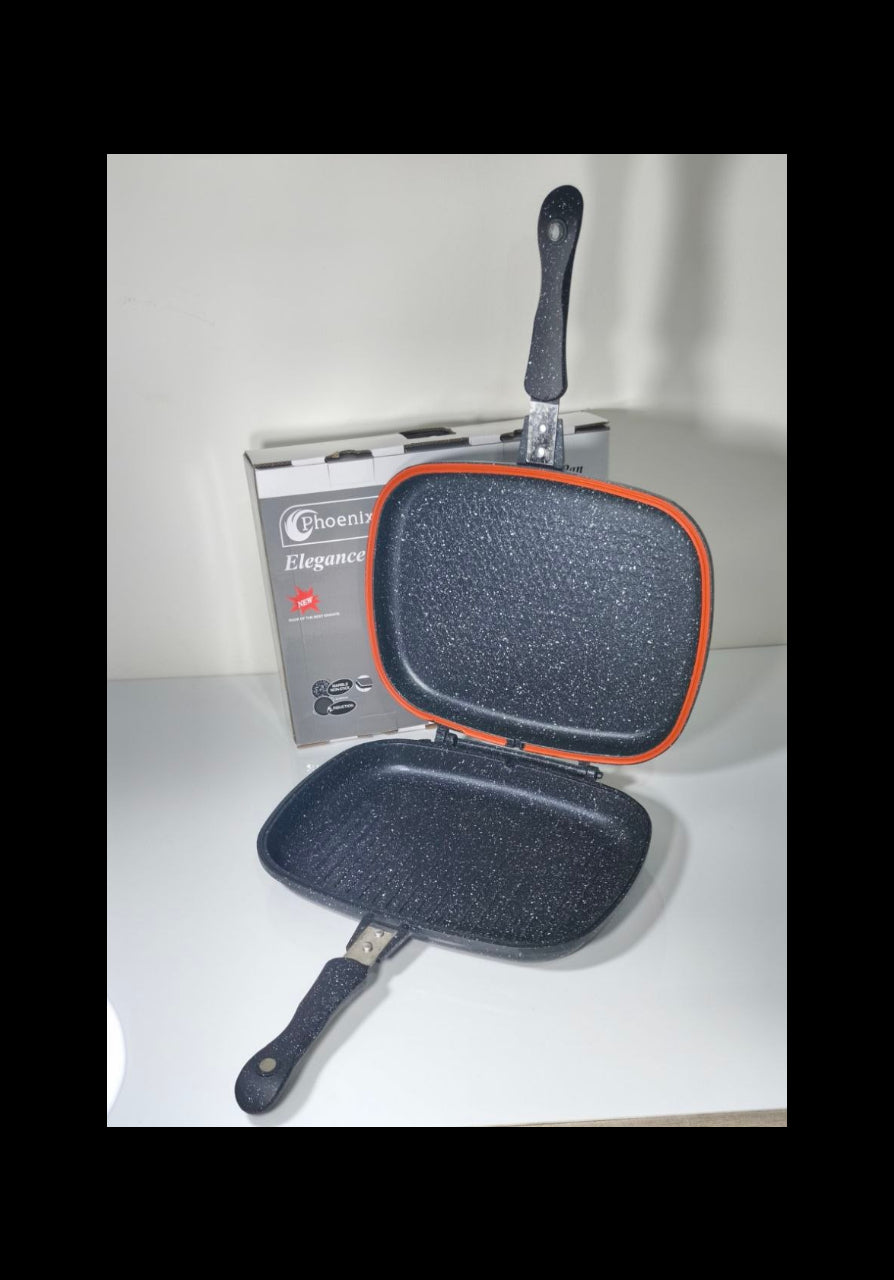 An open Phoenix Elegance non-stick grill pan with a dark gray speckled interior and a bright orange-red rim, displayed in front of its gray retail box on a white surface.